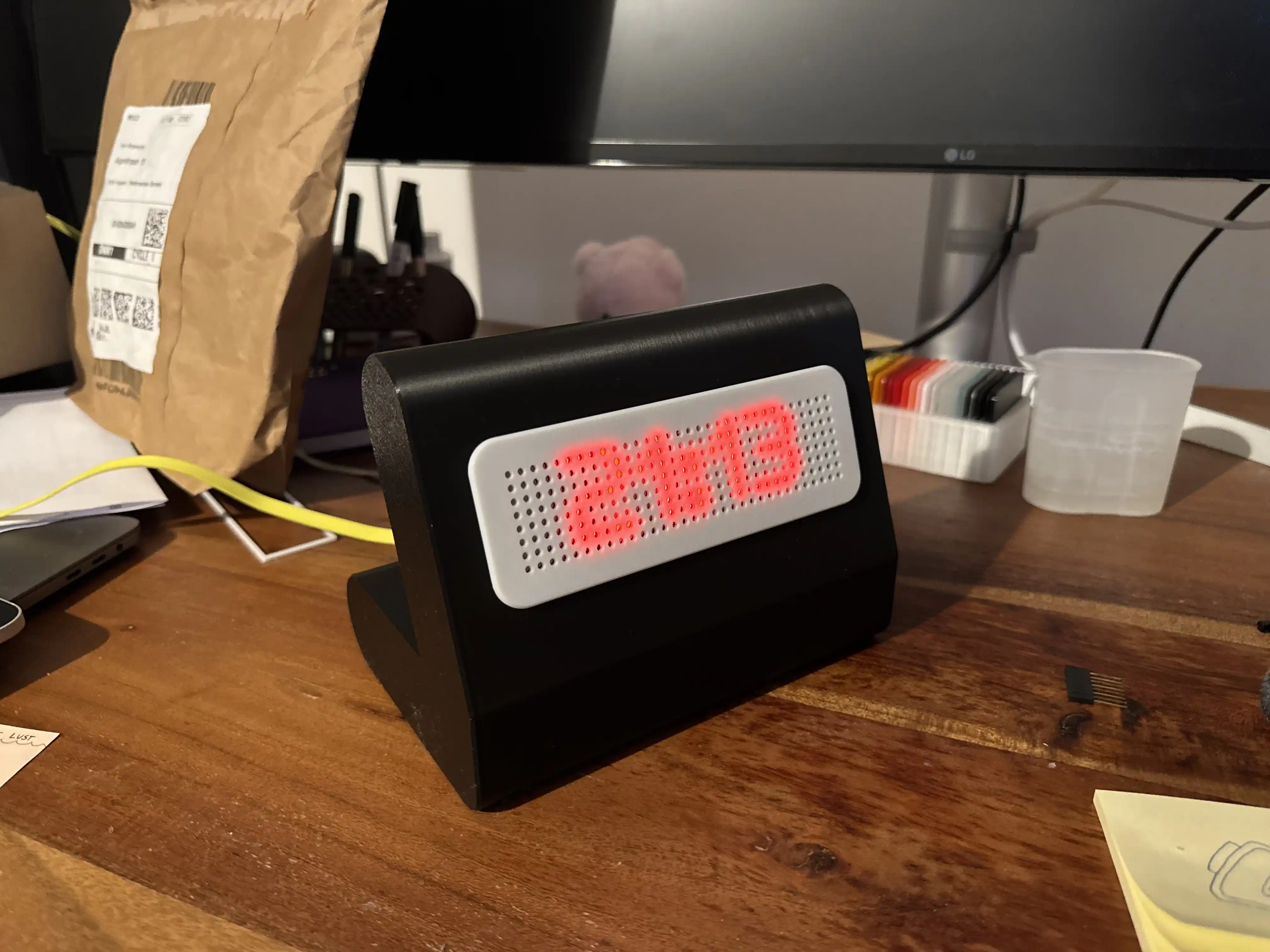 A self-built clock with a matrix dot display and a self-printed housing.