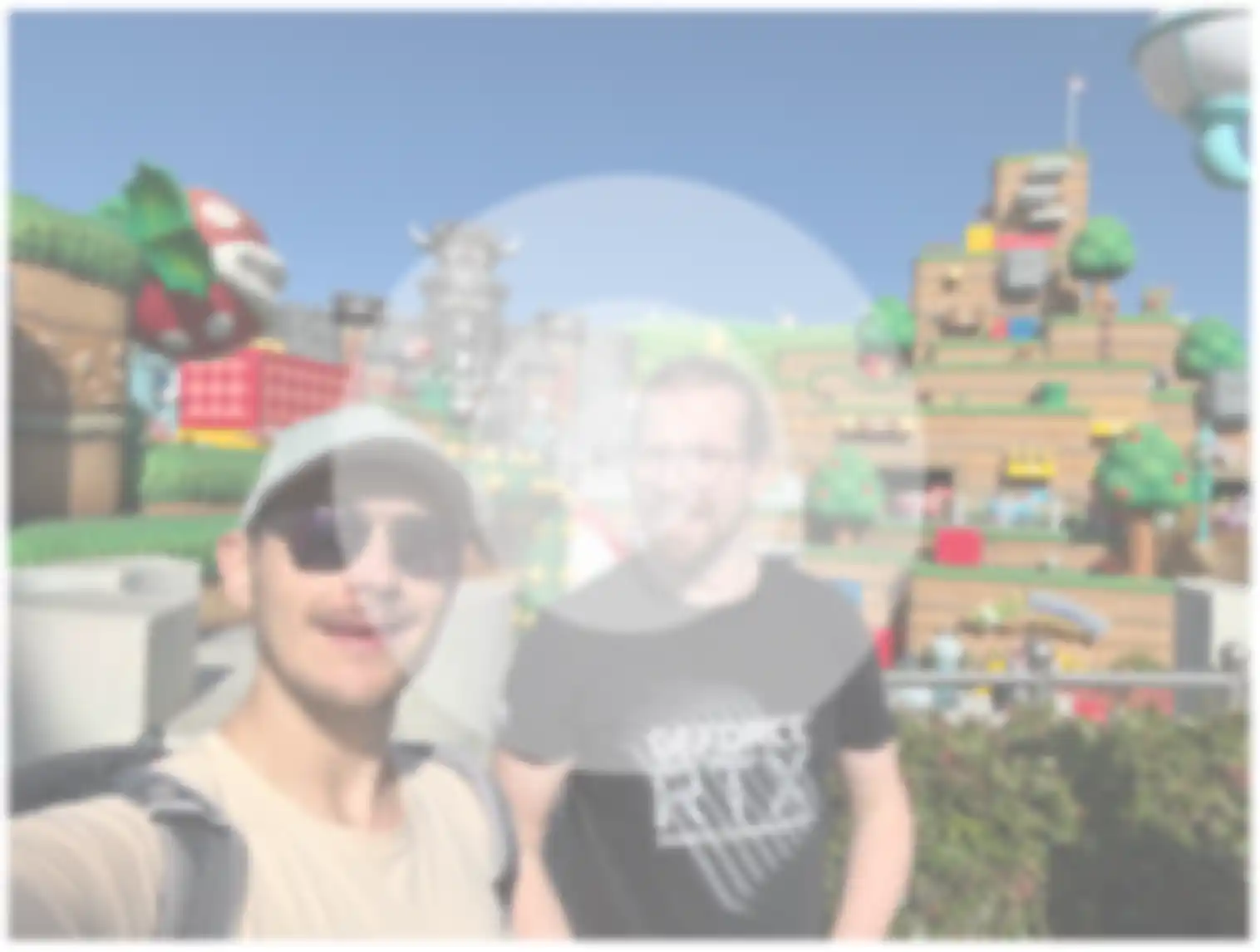 An example of how blurry I can see with my right eye. You can see two men in the middle of the picture around the Nintendo world with a lot of joyful colors, but everything is milky and you cannot see it in bright colors because of the cataract in my right eye. The center is more blurred and also whiter than the rest.